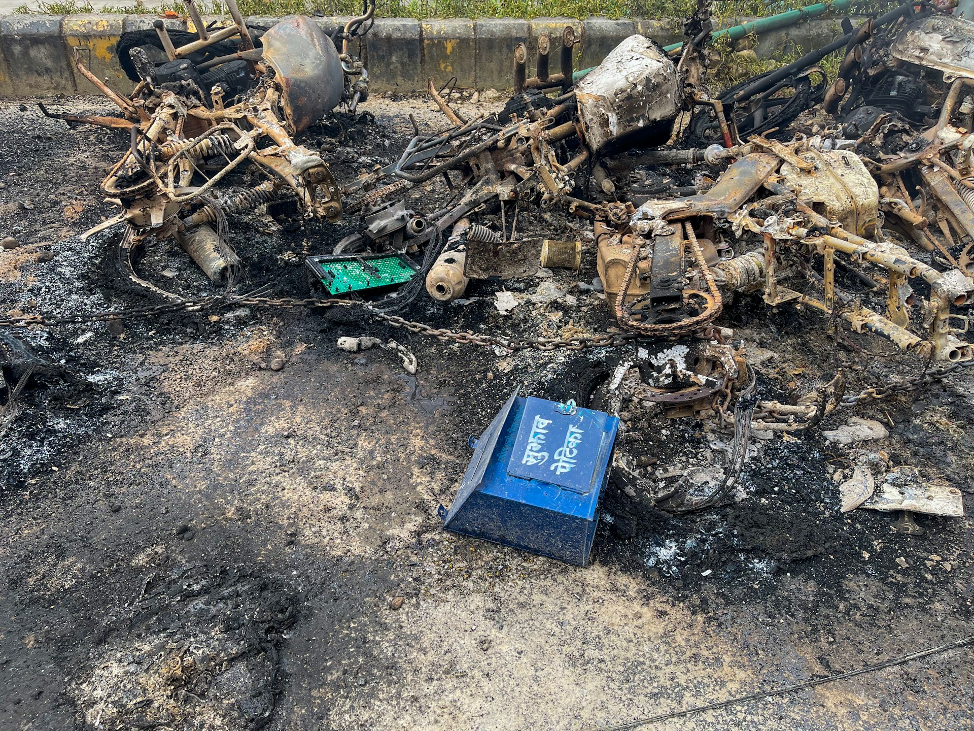 Debris from a fire with a blue box.